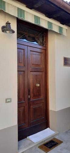 a wooden door with a stove in a room at La Forosetta Guest House in Norcia