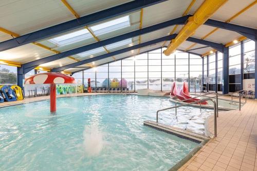 a large swimming pool with a water slide at Sea La Vie Lodge in New Quay