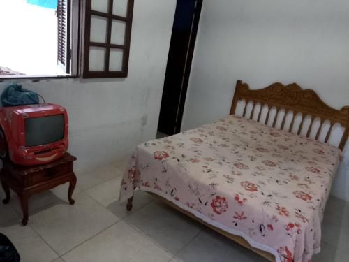 Giường trong phòng chung tại Casa na ilha da Gamboa - Mangaratiba