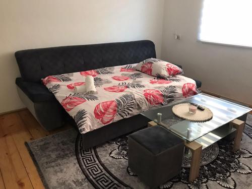 a living room with a couch and a table at Apartman Mario in Bihać