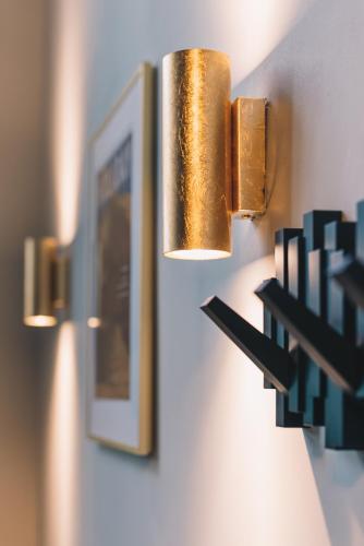 two lights hanging on a wall with a picture at LVM Stays in The Hague