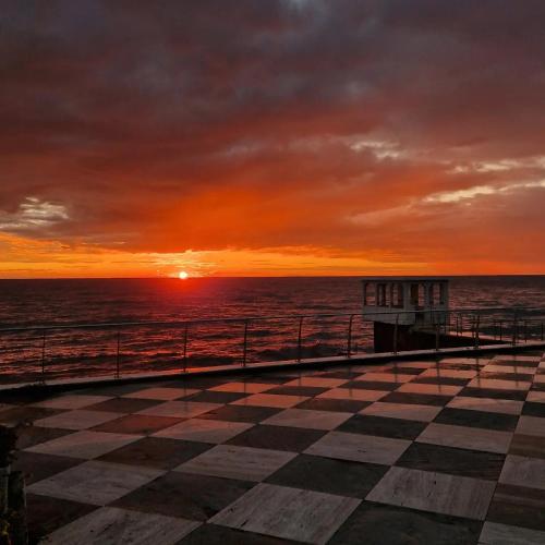 a view of the ocean from a pier at sunset at Hotel Ristorante Maga Circe in San Felice Circeo
