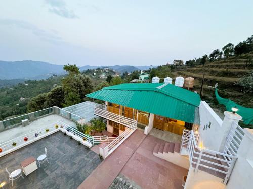 an image of a house with a green roof at Wanderlust Mukteshwar in Mukteswar