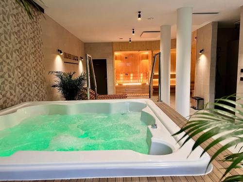 a jacuzzi tub in the middle of a house at SILVER BALTIC in Kołobrzeg