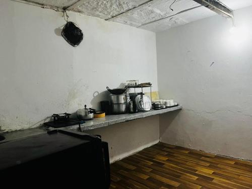 a kitchen with pots and pans on a counter at wide Hotel in New Delhi