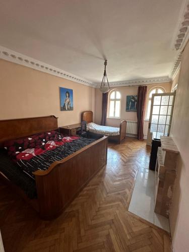 a bedroom with a large bed in a room at City center apartment in Constanţa