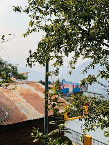 a street light in front of some roofs at Sanchi's Homestay 2BHK in Bhowāli