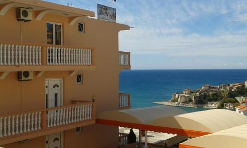 a building with a view of the ocean at Apartments Panorama Alaj in Ulcinj