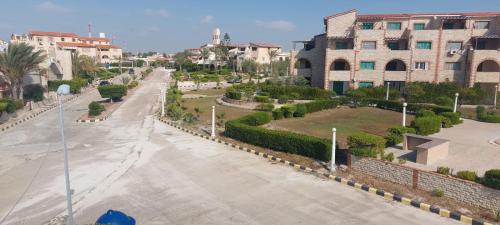 an aerial view of a street in a city at شاليه في قرية هيلو بيتش في الكيلو ٥٠ in Borg El Arab