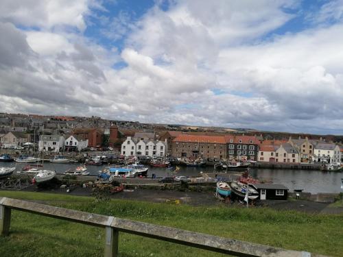 a view of a harbor with boats in the water at 3-Bed Lodge with SeaView-Fireplace-Garden-FreeP in Eyemouth