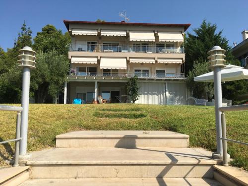 a building with a staircase in front of it at Heavenly place in Possidi