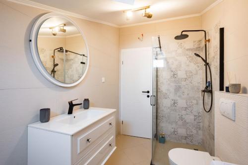 a bathroom with a sink and a mirror at Seashell in Split