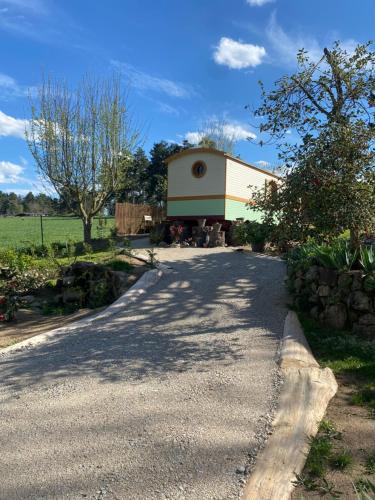 a building on the side of a road at Roulotte quatre saisons Chez Sophie et Gilles in Monistrol-sur-Loire