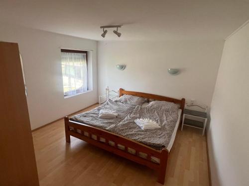 Postel nebo postele na pokoji v ubytování Nyugalom Szigete Vendégház