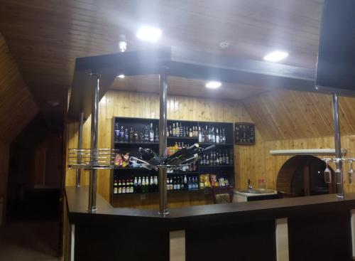 a bar with a lot of bottles of alcohol at Star Hotel in Shamakhi
