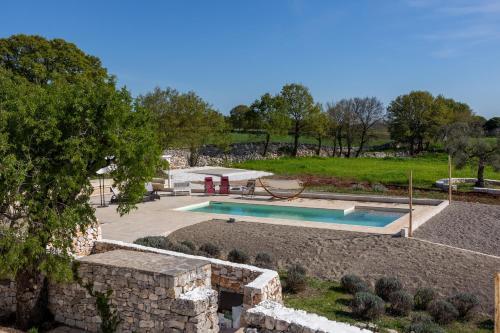 Πισίνα στο ή κοντά στο Trullo Dimora Podere Papilio