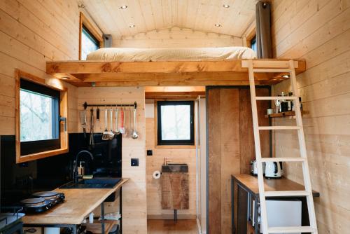 a tiny house with a bunk bed in it at Berta Tiny house in Verlaine