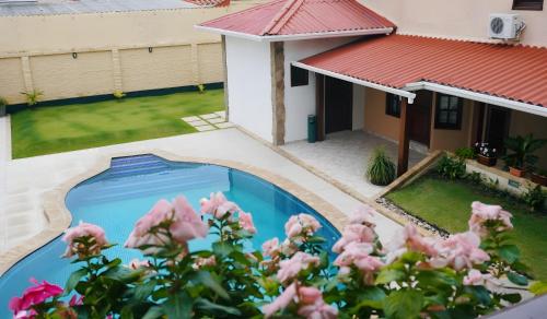 an overhead view of a house with a swimming pool at Hotel By Armonía Santa Cruz in Santa Cruz de la Sierra