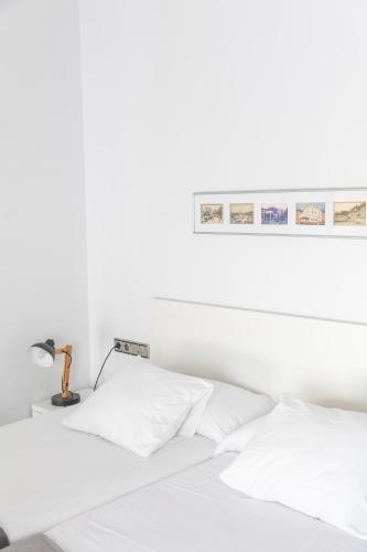Ένα ή περισσότερα κρεβάτια σε δωμάτιο στο Mazi Apartments Colón