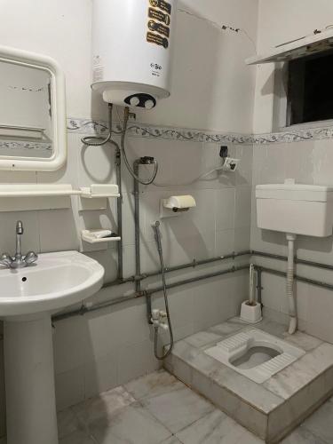 Vannas istaba naktsmītnē Singay Homestay