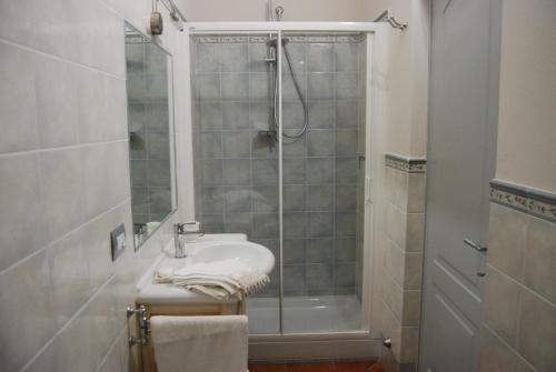 a bathroom with a shower and a sink and a shower at Casa Girella in Terontola