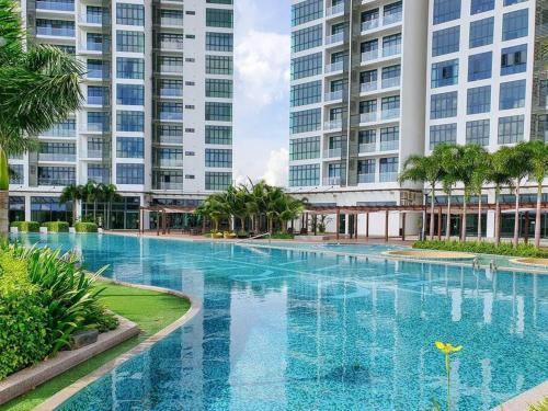 a large swimming pool in front of two tall buildings at ABHOME "KOREA SUITE" #Green Haven #360"City View #Masai JB in Masai