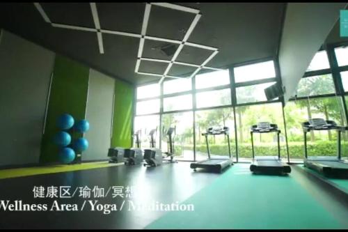 a room with a gym with a large window at ABHOME "KOREA SUITE" #Green Haven #360"City View #Masai JB in Masai