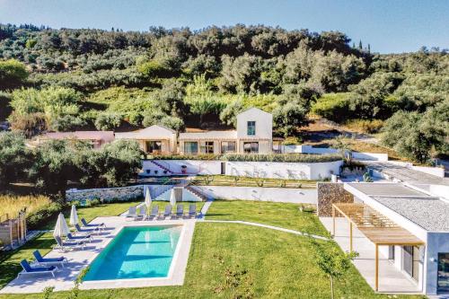 an aerial view of a house with a swimming pool at Kumquart estate- Kumquat in Aspiotádes