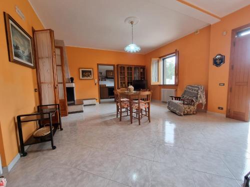a living room with a table and chairs at CASA VIANNA in Magliano