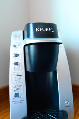 a coffee maker is sitting on a table at Edge Hotel Washington Heights in New York