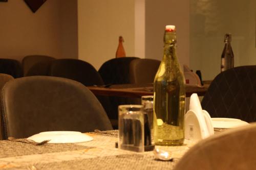 a bottle of wine sitting on top of a table at Hotel Beyond Blu,Port Blair in Port Blair