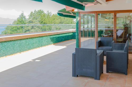 a house with a view of a swimming pool at Hotel & Spa Tino Sveti Stefan in Ohrid