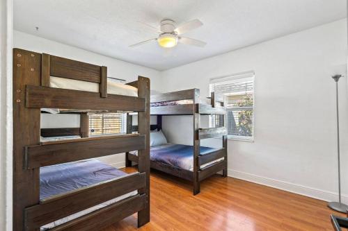 a room with three bunk beds in a house at Curated 2BR/1BA-6 ppl under 1 mile to Downtown in St. Petersburg