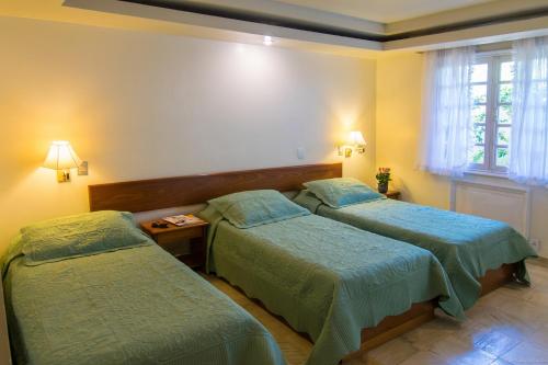 En eller flere senge i et værelse på Hotel Doce Mar