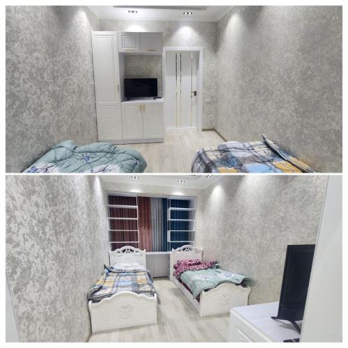 Cette chambre comprend 2 lits et une télévision. dans l'établissement Апартамент 2, à Samarcande