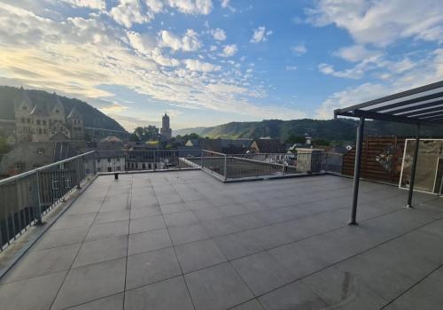 a large balcony with a view of a city at Altstadt-Glück - Terrasse&Sauna in Andernach