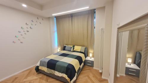 Ένα ή περισσότερα κρεβάτια σε δωμάτιο στο Apartament Bologna-Stadio 1
