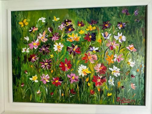 a painting of a field of flowers at Regina e Oriente in Baveno