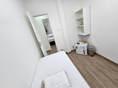 Ένα ή περισσότερα κρεβάτια σε δωμάτιο στο Quarto Privativo em Condominio
