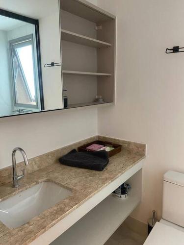 a bathroom counter with a sink and a mirror at For You Moema 302 Studio da Andrea in São Paulo