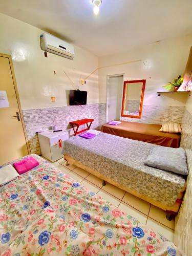 Llit o llits en una habitació de Pousada Tianguá - Top Demais