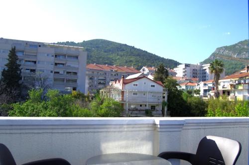 a view of a city from a balcony at Glory Suites in Budva
