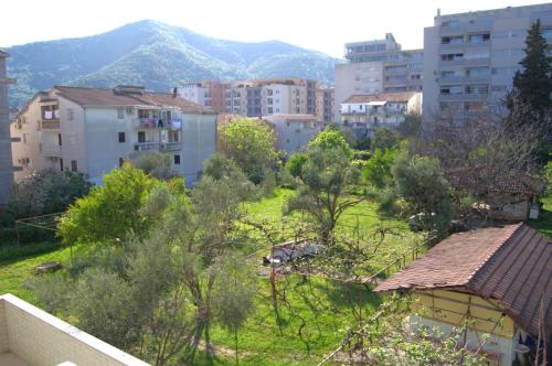 a view of a city with buildings and trees at Glory Suites in Budva