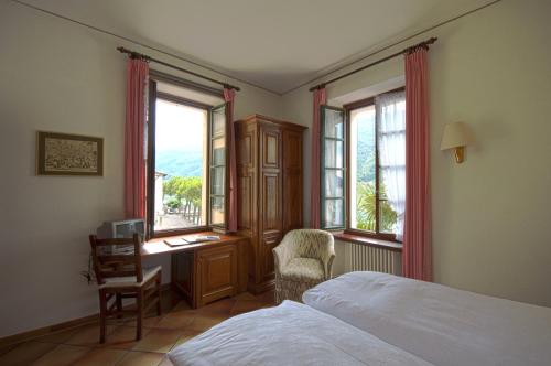 A bed or beds in a room at Albergo Ristorante della Posta