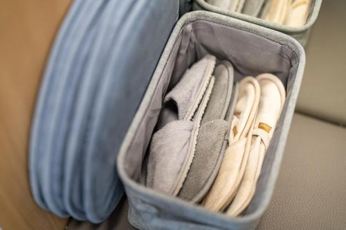 an open suitcase with a bunch of towels at Bubbly Apartment in Bled