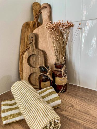 a room with a wooden cutting board and a chair at L'Adresse - Rempart Sud - Eguisheim avec garage privé in Eguisheim