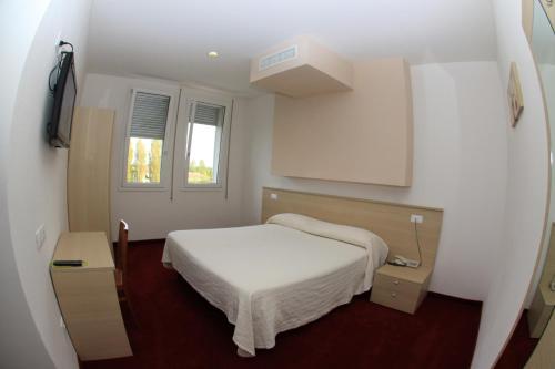 Un pat sau paturi într-o cameră la Park Hotel Italia