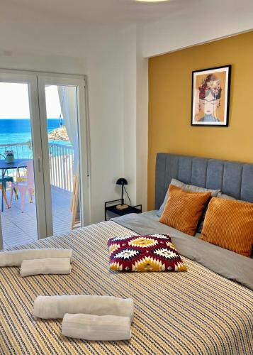 a bedroom with a bed with a view of the ocean at El Bikini Cullera - Junto a la playa - Right on the beach in Cullera
