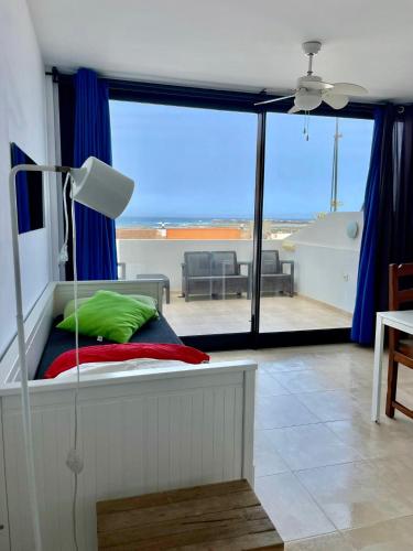 a bedroom with a bed with a view of the ocean at Casa Nemo Cotillo Mar in El Cotillo