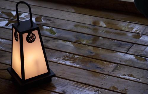 a lantern sitting on top of a wooden table at Tangyue Resort in Taian